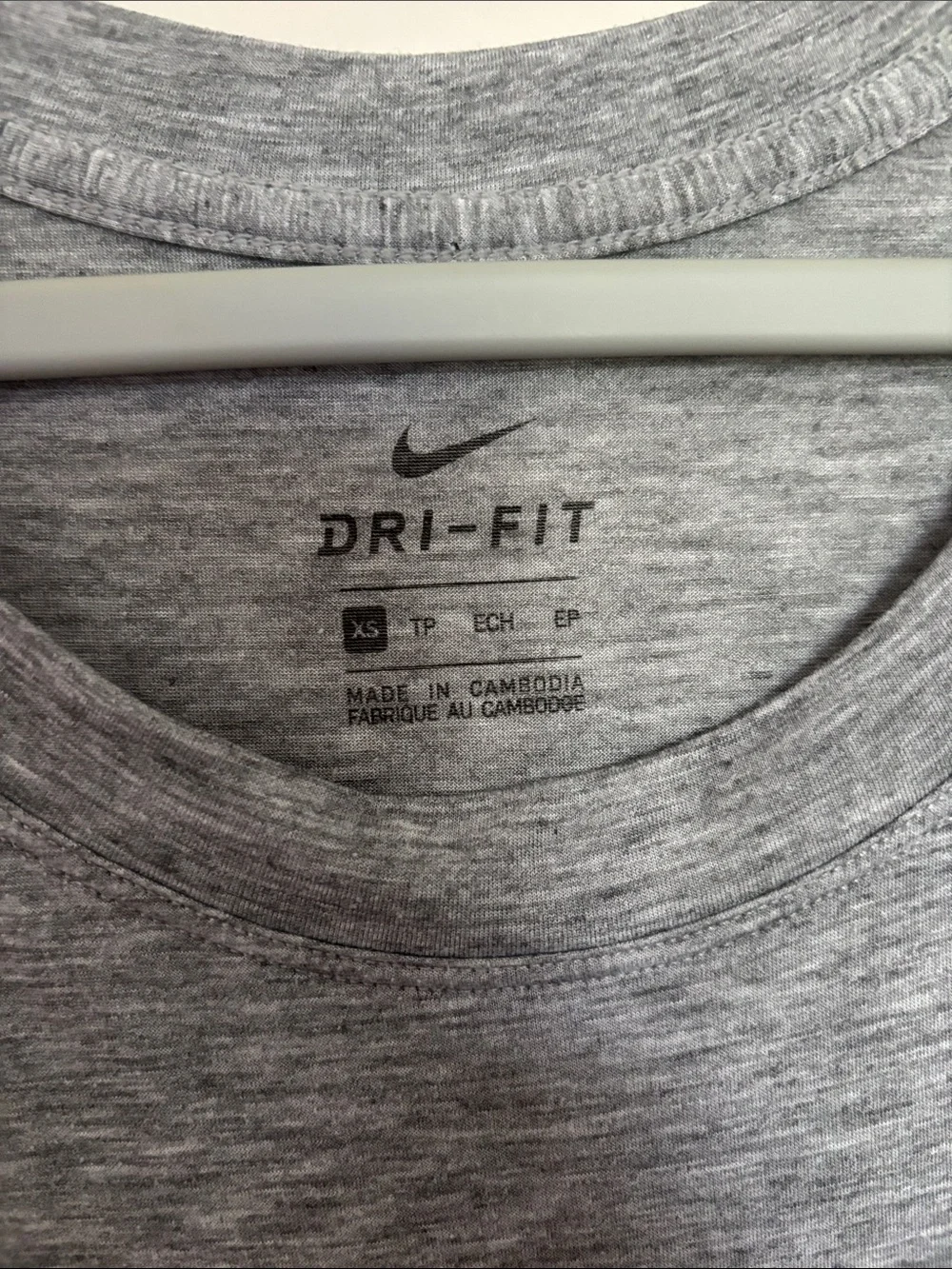 Woman’s Nike Gray Dri-FIT Heathered Performance Tee with Mesh Sleeves